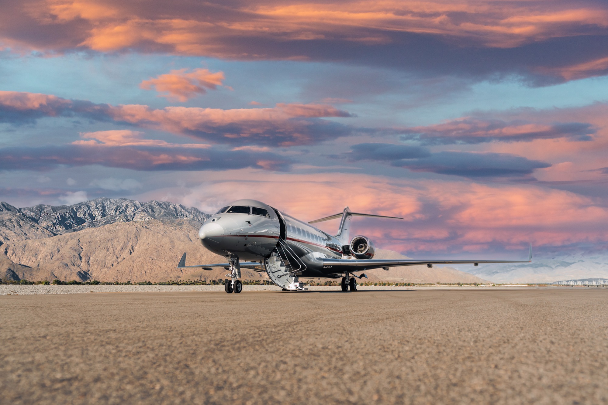 A vistajet parked on a runway