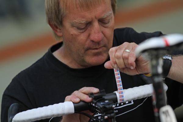 Mechanic Andy Stone has been wrenching for teams for 10 years. Here he applies the finishing touches to a bike getting new bar tape, which can often be changed out every few days during a stage race.