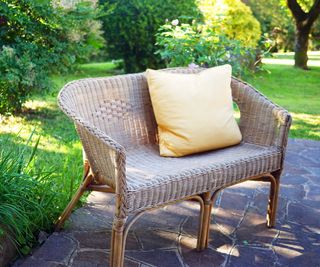 Rattan furniture with cushion in garden