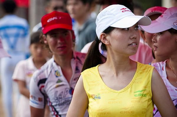Yes it's my turn for podium, the yellow jersey is behind me': Justin Jules (Velo Club/La Pomme Marseille) checks to see his chaperone is on the ball in Wenchang.