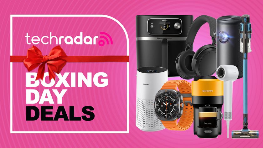 Assortment of tech and home appliances on a pink background with "Boxing Day deals" text overlay.
