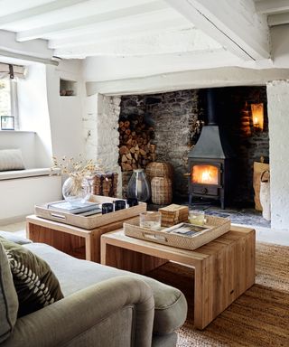 White living room with rustic inglenook fireplace