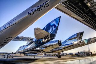 Virgin Galactic's spaceship Unity and its carrier plane the VMS Eve are seen during preparations for a test flight on May 1, 2017 based out of the Mojave Air and Space Port in California.
