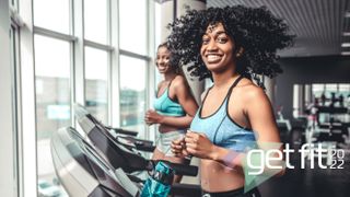Two women running on treadmills in a gym