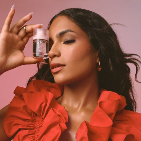 Content creator Monet McMichael poses with Snif's Rose Era Eau de Parfum