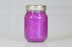 Glitter jar with purple glitter