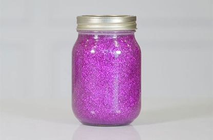 Glitter jar with purple glitter