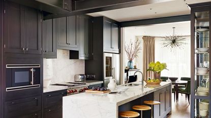 Kitchen with dark grey cabinets