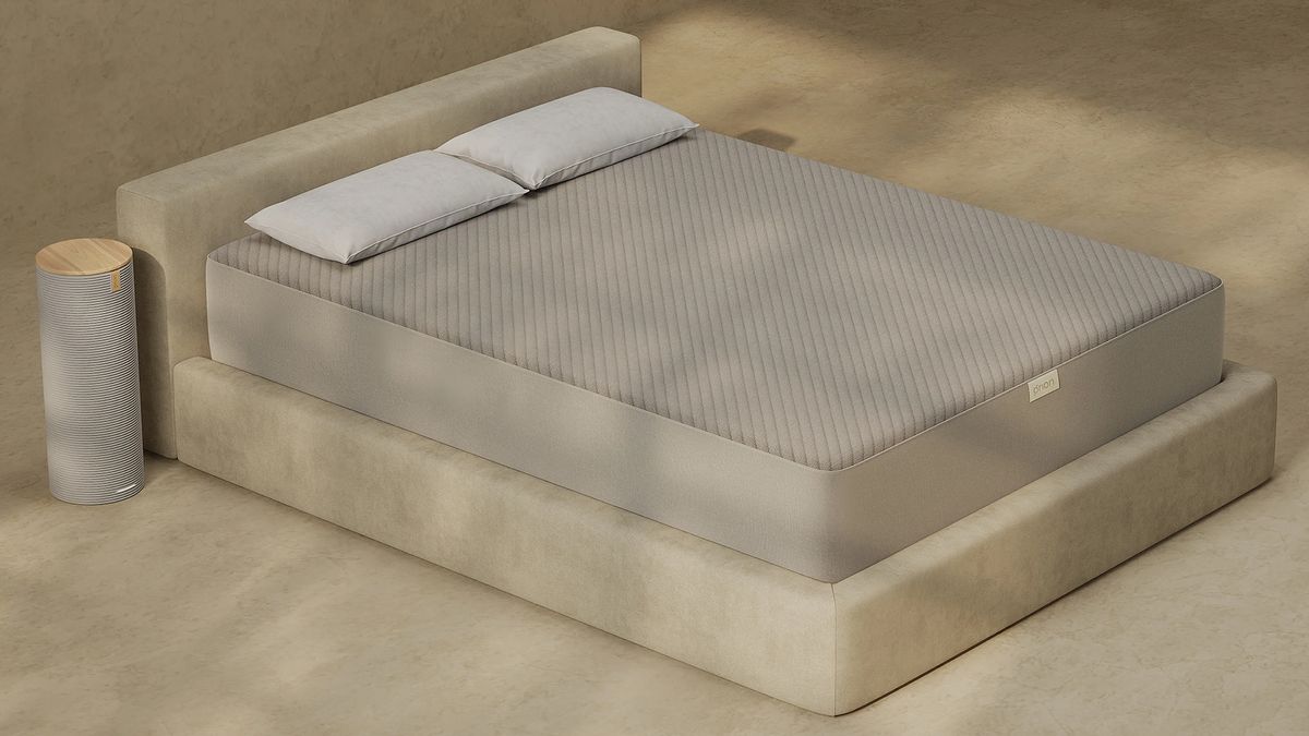 The Orion mattress cover on a bed with the Orion Control Tower next to the mattress
