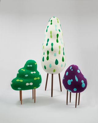 Masako Miki, Left: Animated Pine Tree, 2021; Middle: Animated Hinoki Tree, 2021; Right: Dango Mushi Ghost (Roly-Polly Insect Shapeshifter), 2021, all wool on EPS foam, walnut wood. Photography: John Wilson White. Courtesy of the artist and CULT Aimee Frib