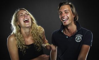 portrait of two people laughing