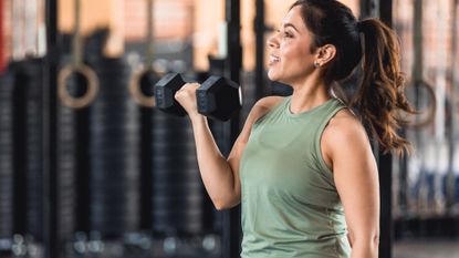 A woman exercising with a dumbbell