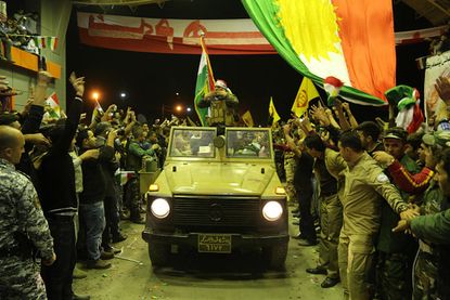 Iraqi Kurdish peshmerga fighters are on their way to help defend Kobani from ISIS