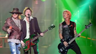 Singer Axl Rose (L) and bassist Tommy Stinson of Guns N' Roses perform at The Joint inside the Hard Rock Hotel & Casino during the opening night of the band's second residency, "Guns N' Roses - An Evening of Destruction. No Trickery!" on May 21, 2014 in Las Vegas, Nevada