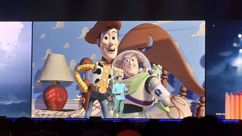 AU 2025; photos of a man stood on a stage in front of video footage