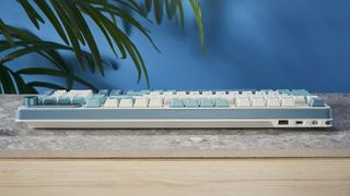 A Royal Kludge S98 wireless mechanical keyboard with blue, teal and white double-shot ABS keycaps