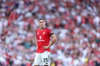 Manchester United's Manuel Ugarte stands with hands on hips after Man United lose to Arsenal