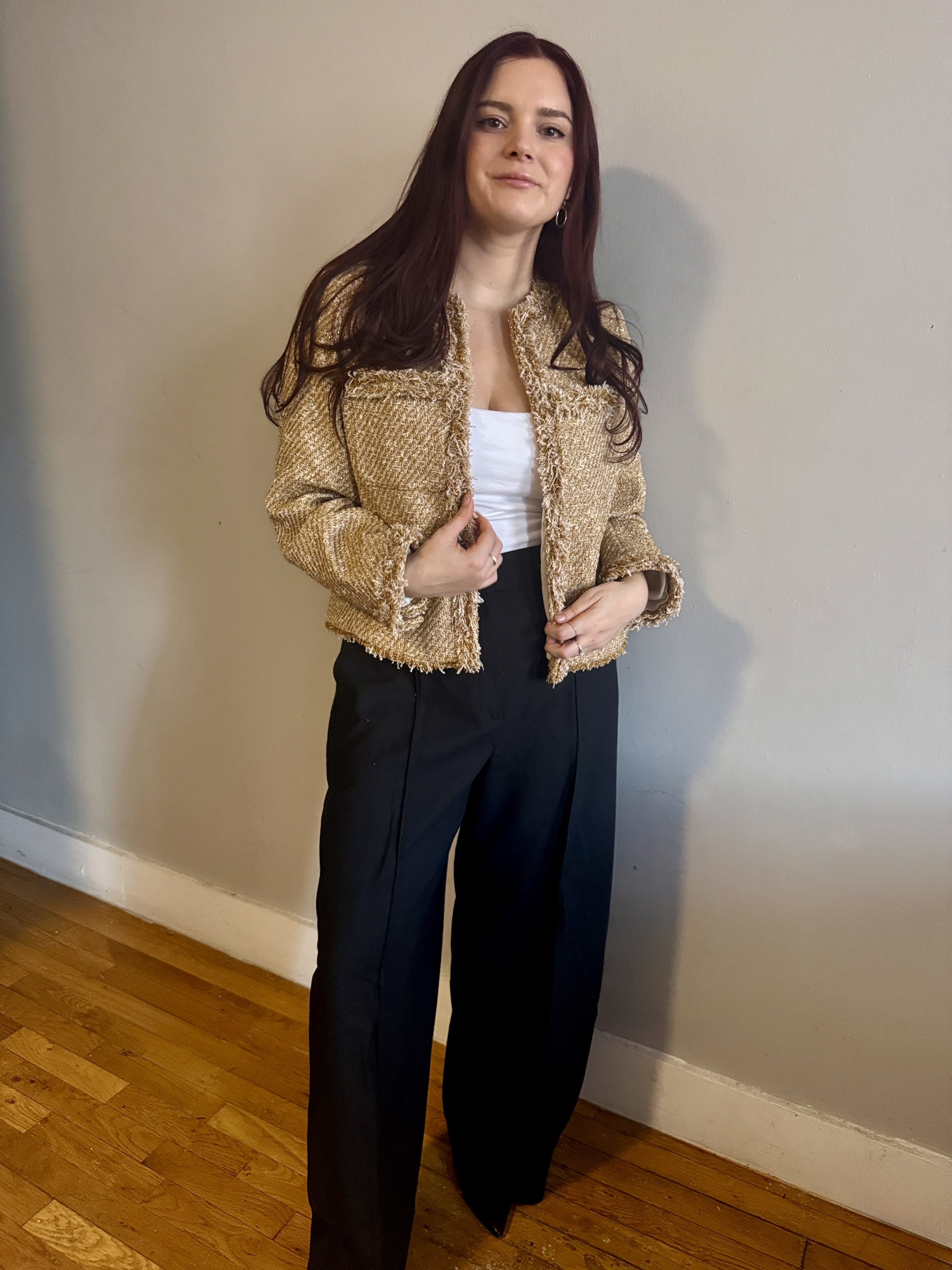 Brooke Knappenberger wearing a gold Me+Em blazer and black trousers