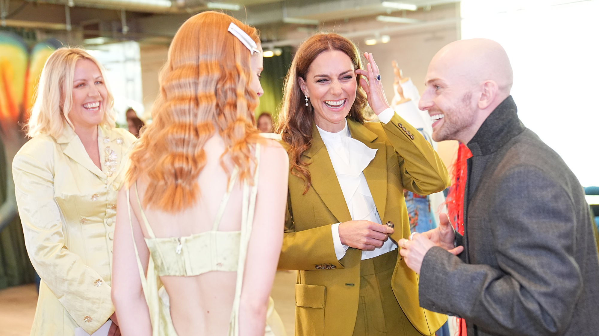 Catherine, Princess of Wales tours design spaces with designer Patrick McDowell (right) and British Fashion COuncil CEO Laura Weir, during a visit to present the Queen Elizabeth II Award for British Design,