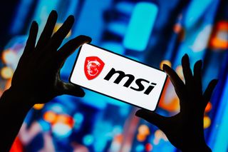 MSI logo displayed on a smartphone screen with blurry multi-colored background behind