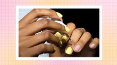 Two hands with lemon yellow nail polish being applied to the nails/ in a pink and yellow template