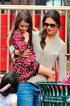 Katie Holmes and Suri Cruise learning to ride a bike