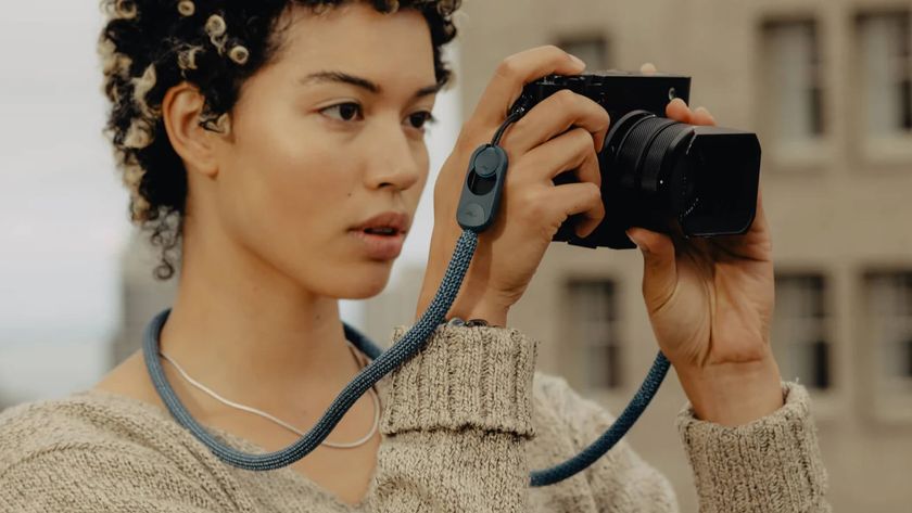 Peak Design 'Form Rope' camera strap attached to a Fujifilm compact camera, and photographer bringing the camera up to their eyes
