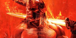 David Harbour as Hellboy holding flaming sword