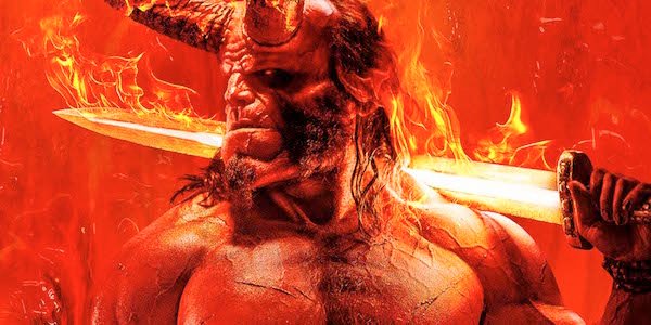 David Harbour as Hellboy holding flaming sword