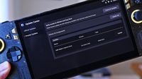 Handheld ROG Ally held in hand, displaying the Update Center screen with a preview update for the AMD Radeon Graphics Driver version 32.0.32015.7029.