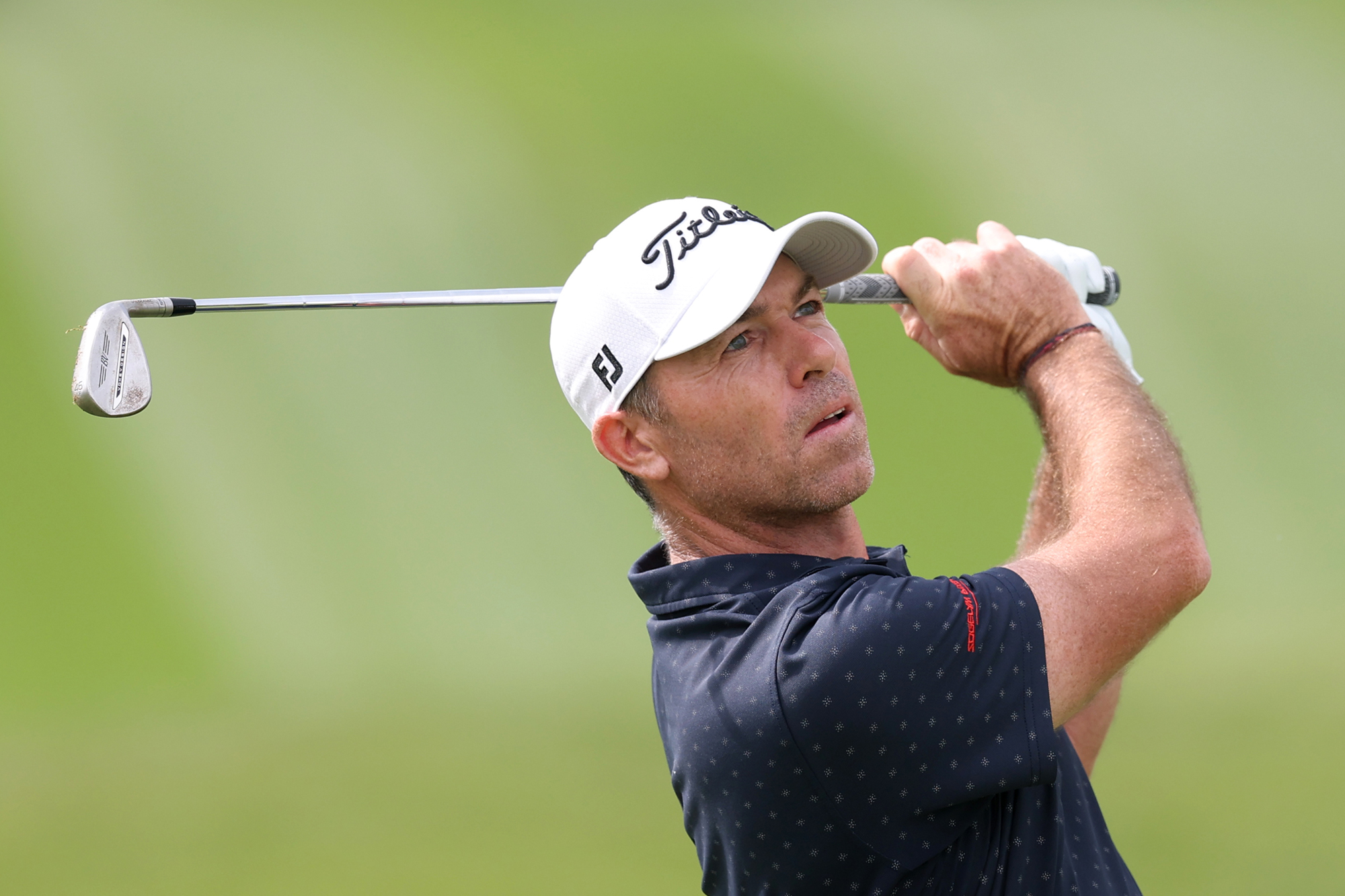 Julien Guerrier in the finish position after hitting an iron at the Dubai Desert Classic 2026