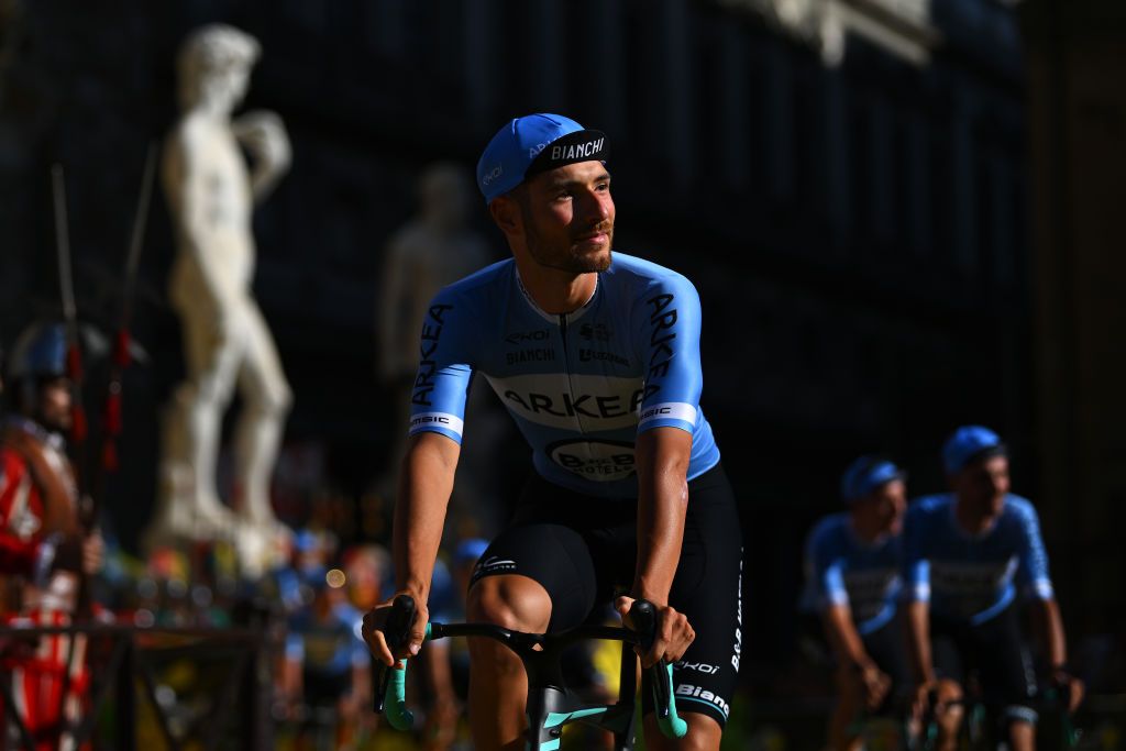 FIRENZE ITALY JUNE 27 Luca Mozzato of Italy and Team Arkea BB Hotels with the Michelangelos David statue in the background during the 111th Tour de France 2024 Team Presentation UCIWT on June 27 2024 in Firenze Italy Photo by Dario BelingheriGetty Images
