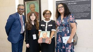 NASA Johnson Space Center director Vanessa Wyche (second from right) holds a portrait of "human computer" Dorothy Vaughan near the dedication plaque for the newly-named "Dorothy Vaughan Center in Honor of the Women of Apollo" together with invited guests on Friday, July 19, 2024.