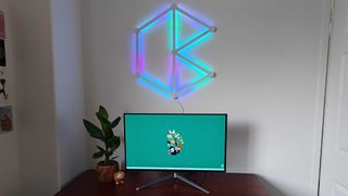 Nanoleaf Lines kit attached to wall next to gaming desk setup