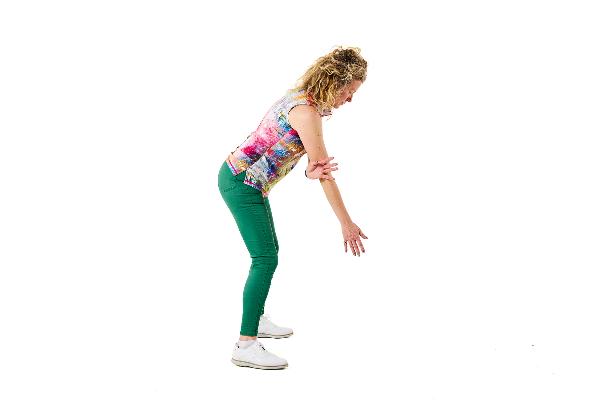 Katie Dawkins demonstrating a drill to fix the flying elbow, with her lead hand tucked behind her trail elbow