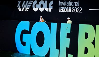 LIV Golf banner with a golfer walking across it