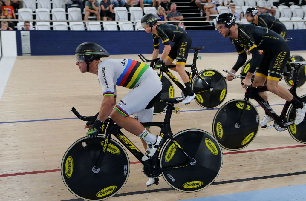 Sam Welsford, in rainbows, leading the team pursuit squad off and to gold medal success