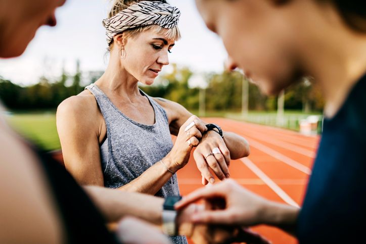 Women looking at their fitness trackers