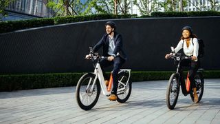 Couple riding NIU BQi-C3 Pro E-bike