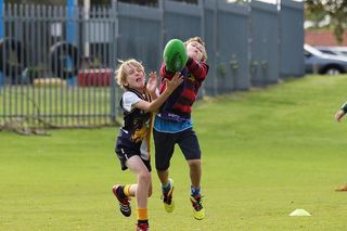 Boys catching a football, concussions