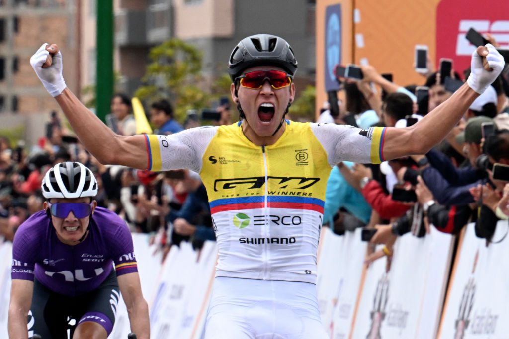 Colombia's cyclist Alejandro Osorio (R) of the GW Erco Shimano team celebrates after winning the third stage of the Tour Colombia UCI 2024 in Tunja, Colombia, on February 8, 2024. (Photo by Luis ACOSTA / AFP)