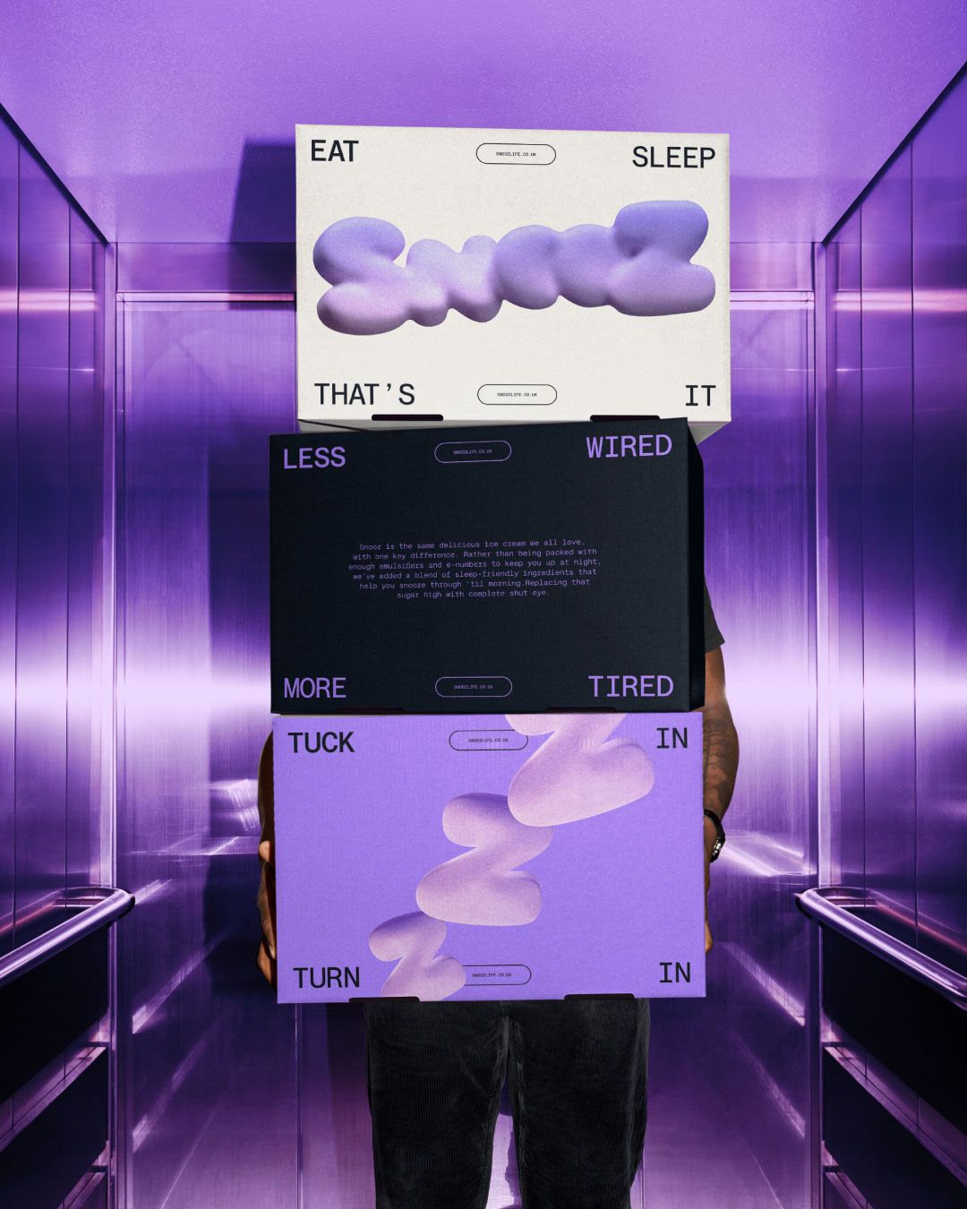 boxes of ice cream being held by person in purple background