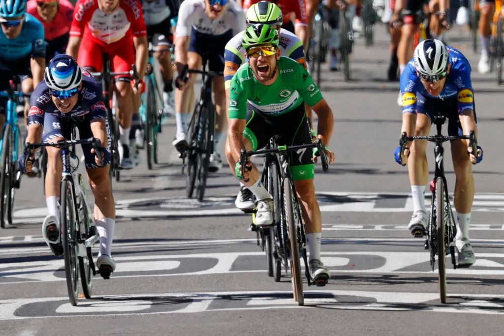 Stage winner Team Deceuninck Quicksteps Mark Cavendish of Great Britain wearing the best sprinters green jersey crosses the finish line at the end of the 13th stage of the 108th edition of the Tour de France cycling race 219 km between Nimes and Carcassonne on July 9 2021 Photo by Thomas SAMSON AFP Photo by THOMAS SAMSONAFP via Getty Images