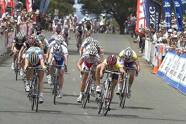 Rochelle Gilmore (right) of the Honda Women's Cycling Team throws her bike at the line to edge out Belinda Goss of Pitcher Partners to win race two.
