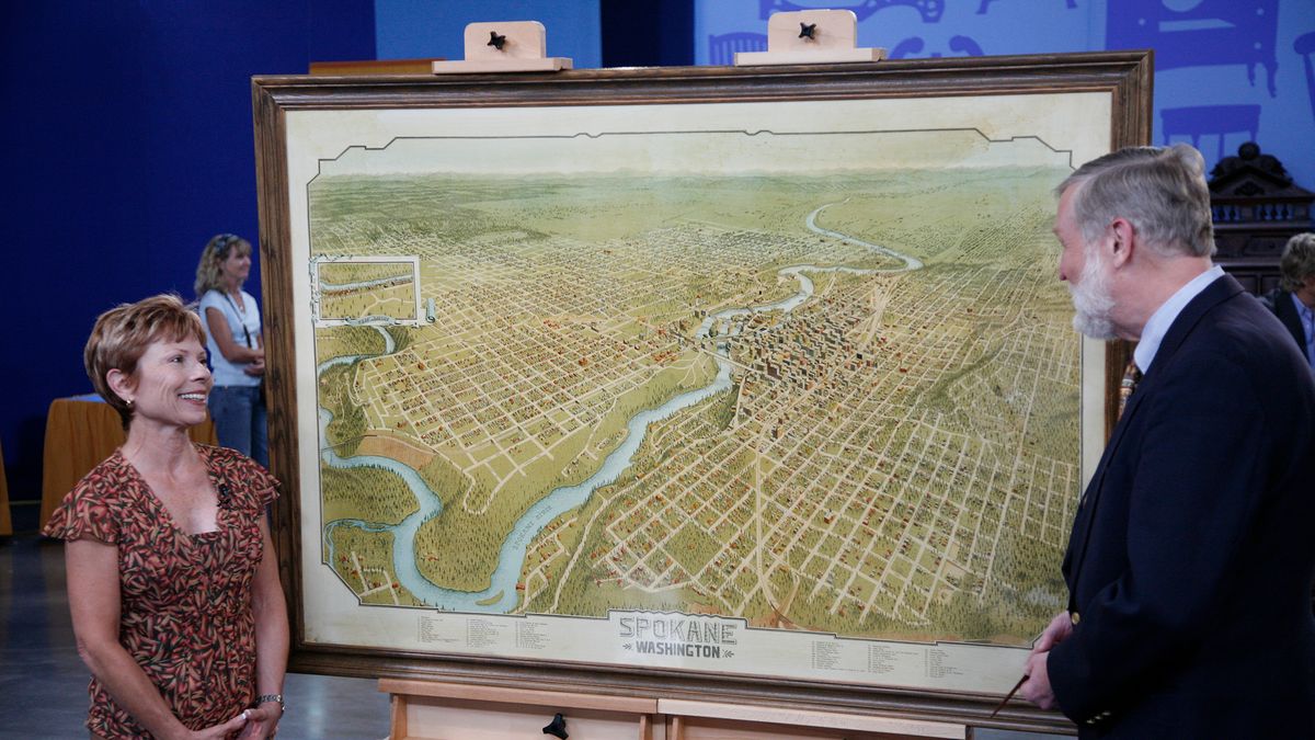 Donald H. Cresswell (right) appraises a 1905 Spokane bird&#039;s-eye view lithograph in Spokane, WA