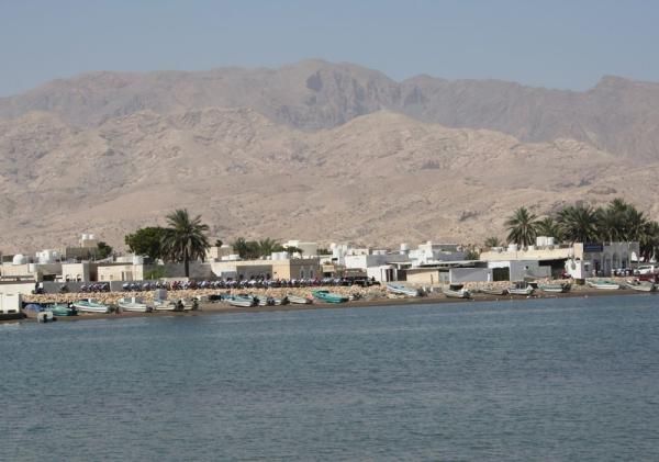 The Tour of Oman peloton rides through Quarayyat.