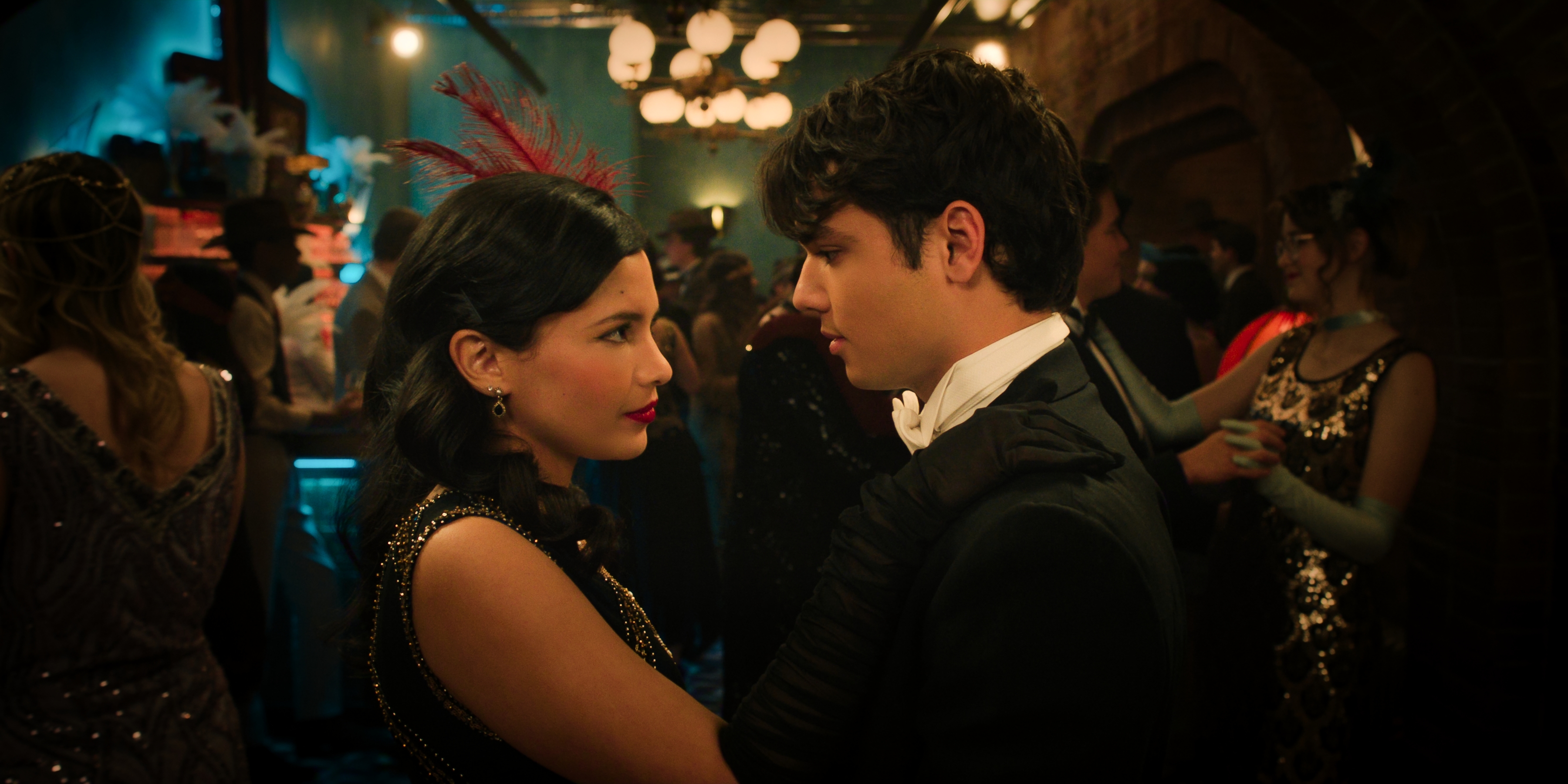 Nikki Rodriguez as Jackie Howard, Naveen Paddock as Elliot looking into each others eyes dressed up on the dance floor of a party in episode 10 of my life with the walter boys season 3