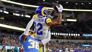Lance McCutcheon #82 of the Los Angeles Rams makes a touchdown catch over Brandon Sebastian #38, to take a 29-22 lead, during a 29-22 win in a preseason game at SoFi Stadium on August 13, 2022 in Inglewood, California.