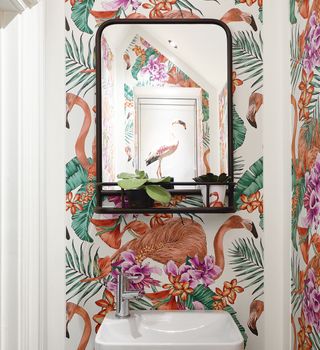 swan and flower designed wall with mirror and wash basin