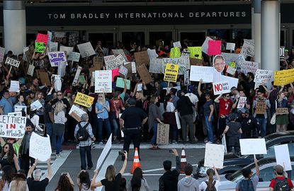 Demonstrators flock to LAX to protest against the immigration ban.